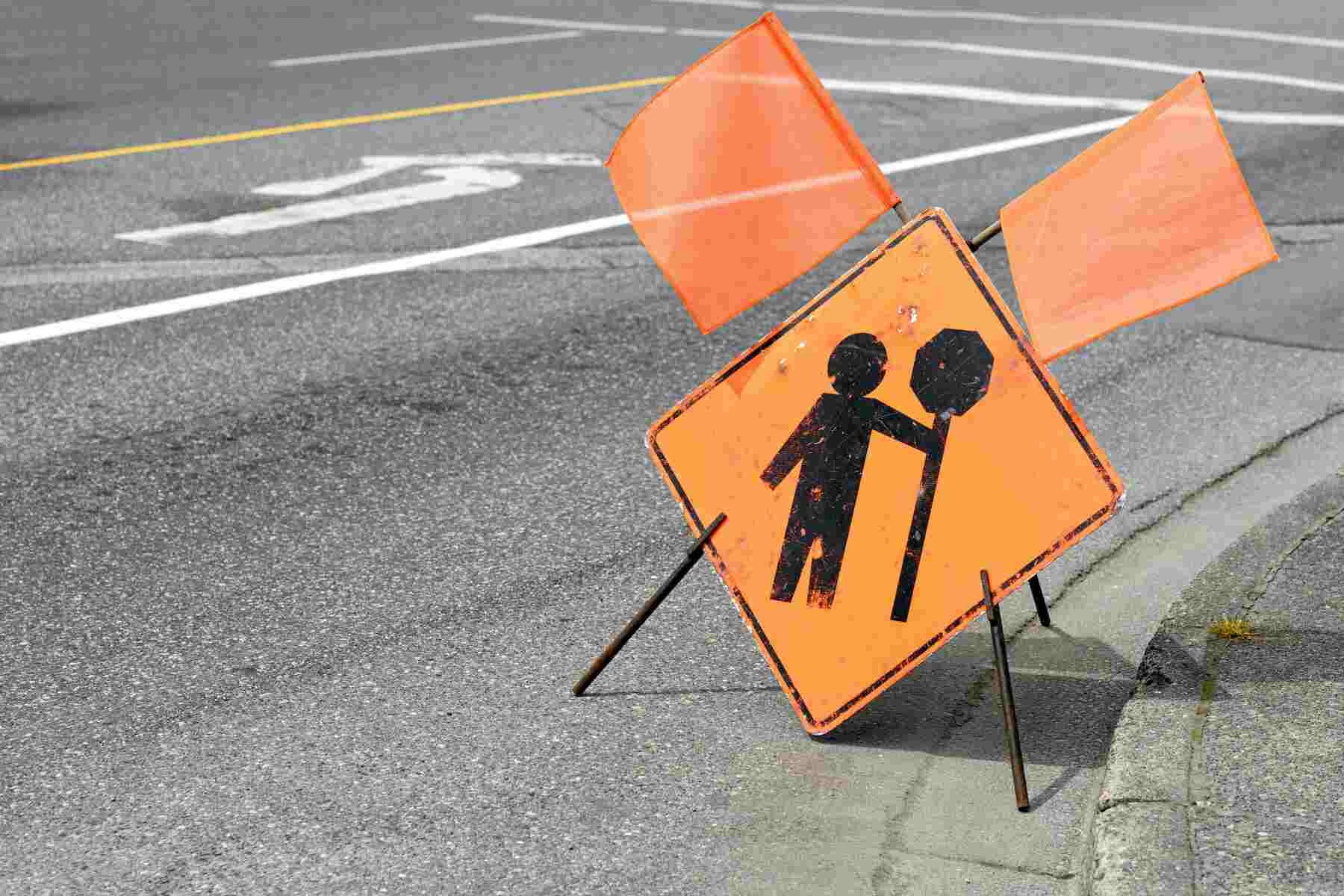 flagger ahead sign